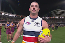 Taylor Walker leaves The Gabba.