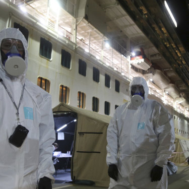 Police officers prepared to board the Ruby Princess to seize evidence for an investigation while it was docked in Wollongong. 