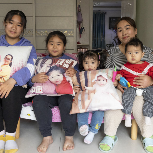 The Zhang sisters Yueying, Boran, Xinyu and Xinran with their mother, Xu Zhenzhen. “I’ve already told my children, ‘Don’t follow in your mum’s footsteps,’ ” says Xu.