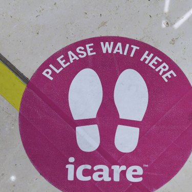 A sticker on the floor in the foyer of icare's building in Sydney.