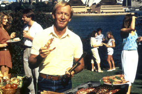 Paul Hogan with his shrimp and barbie in the 1984 Tourism Australia campaign “Come say G’Day”. 