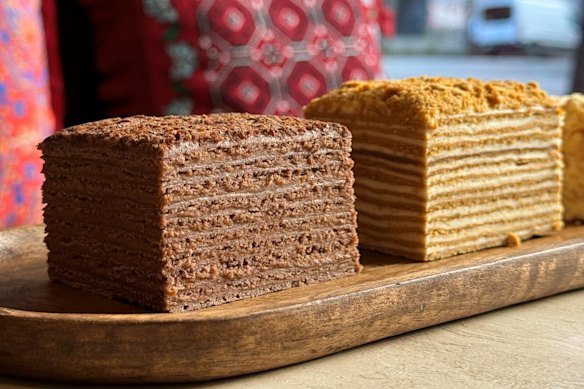 The 12-tier honey cake (right) and choc-caramel mikado with 10 layers at Armenian bakery Tatik’s Delights.