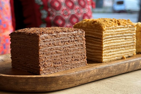 The 12-tier honey cake (right) and choc-caramel mikado with 10 layers at Armenian bakery Tatik’s Delights.