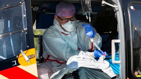 A COVID-19 patient is flown from the Netherlands, where hospitals have been swamped with virus patients, to Germany for treatment.