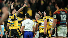 Hurricanes players celebrate the victory.