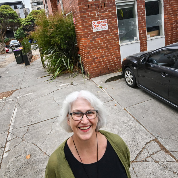 Andrea Cook in her empty car parking space. She has decided to live without a car.