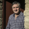 Richard Glover at the door of his mud brick house he built over many decades.