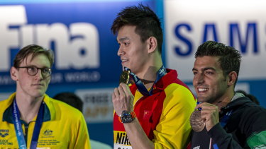 Mack Horton (left) made his point against Sun Yang (centre) but says the focus should shift to racing for the time being.
