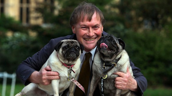 Conservative MP David Amess with his pugs, Lily and Boat.