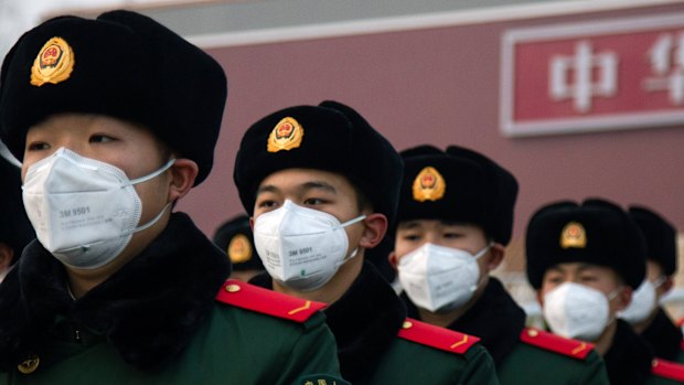 Chinese police officers outside the Tianenmen gate in Beijing. 