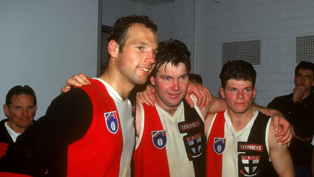 Danny Frawley, centre, celebrates a Saints win with Stuart Loewe and Robert Harvey in 1995.