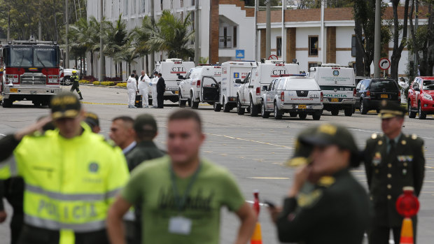 Forensic workers work the scene of the bombing.