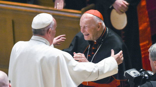 Pope Francis reaches out to hug Cardinal Archbishop emeritus Theodore McCarrick in 2015.