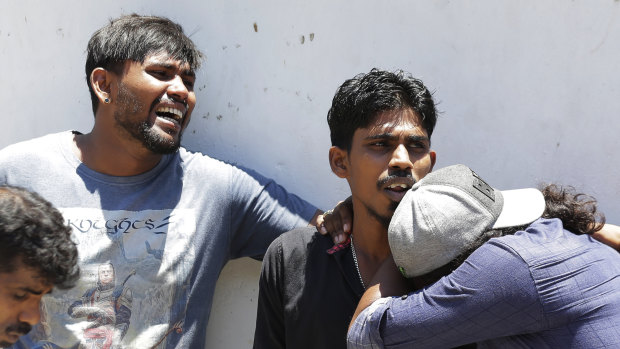 Relatives of people killed in Church blasts mourn as they wait outside mortuary of a hospital in Colombo, Sri Lanka.