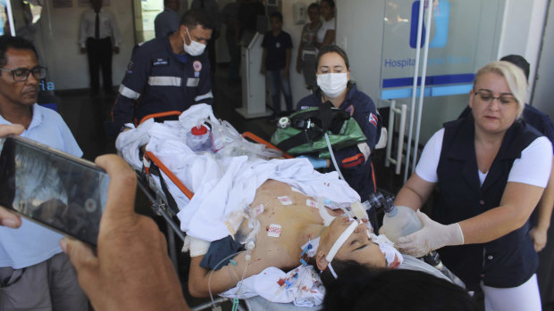 A teenager who was injured during the shooting arrives at hospital.