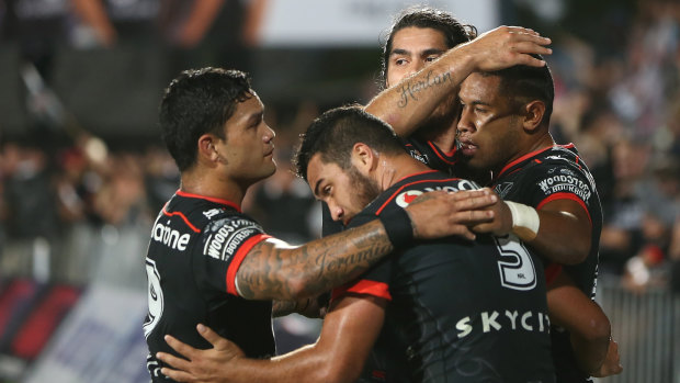 New Zealand Warriors players celebrate a try against the North Queensland Cowboys in round five.