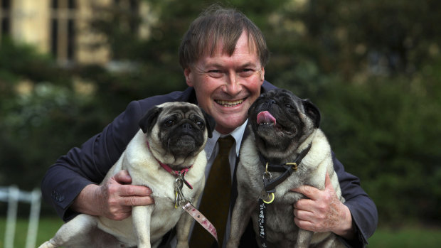 Conservative MP David Amess with his pugs, Lily and Boat.