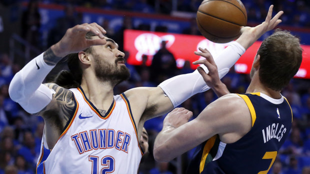 Thunder centre Steven Adams (right) gets into the contest with Utah's Joe Ingles.
