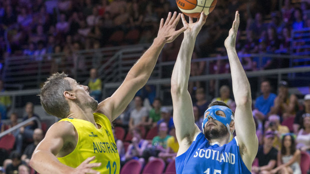Scotland's Alasdair Fraser off-loads a shot against the Boomers.