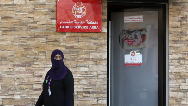 A woman leaves a ladies only service area at a restaurant in Jiddah, Saudi Arabia, on Sunday.