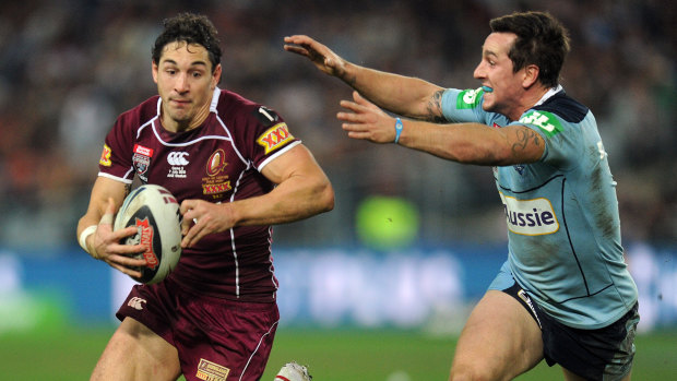Billy Slater tries to escape Pearce's clutches.