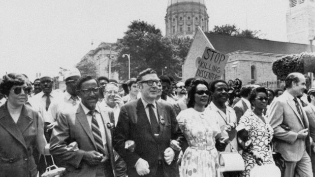 Joseph E. Lowery, second left, Coretta King, centre, help lead several thousand marchers past the state Capitol in Atlanta in a protest march against war, violence and racial repression. 