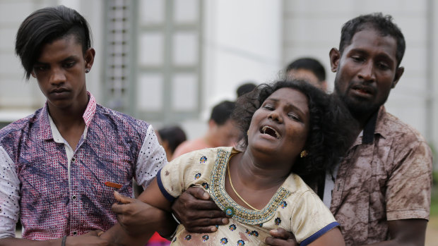 Relatives of a blast victim grieve outside a morgue in Colombo, Sri Lanka. 