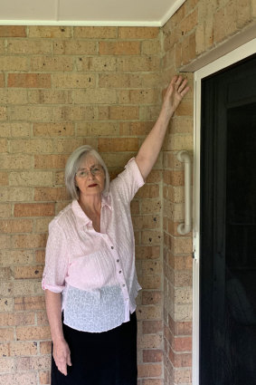 Pensioner Margaret Singleton points out problems at her Lakes Entrance home.