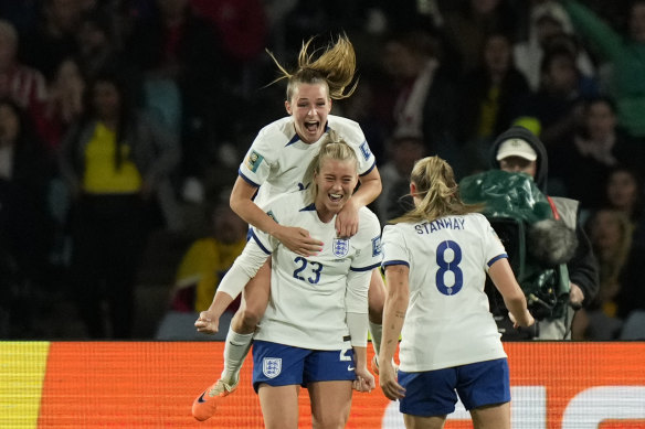 Alessia Russo gets mobbed by her England teammates after scoring the winner against Colombia.