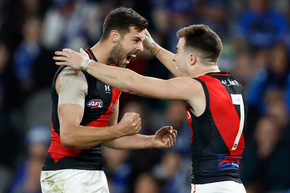 Kyle Langford celebrates with Zach Merrett.