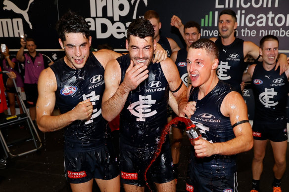 Adam Cerra, George Hewett and Corey Durdin celebrate Carlton’s win in round one.