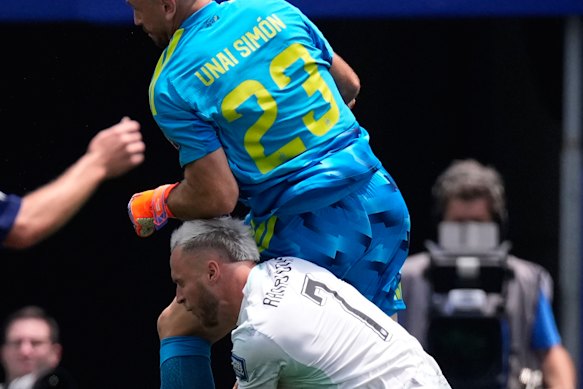 Austria’s Marko Arnautovic is injured after colliding with Spain’s goalkeeper Unai Simon.