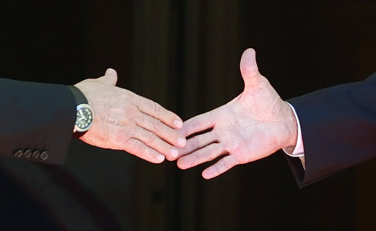 Presidents Joe Biden (right) and Valdimir Putin shakes hands before the summit in June.