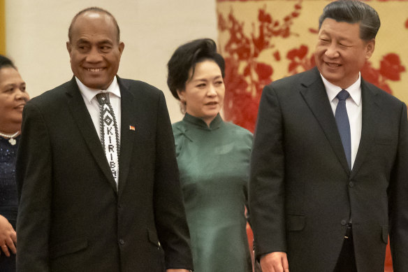 Kiribati’s President Taneti Maamau, left, and Chinese President Xi Jinping walk at the Great Hall of the People in Beijing, Monday, January 6, 2020. China wants 10 small Pacific nations to endorse a sweeping agreement covering everything from security to fisheries in what one leader warns is a “game-changing” bid by Beijing to wrest control of the region.