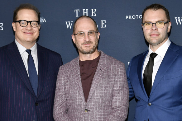 Brendan Fraser, left, with director Darren Aronofsky and writer Sam Hunter, at the premiere of The Whale in New York.