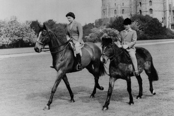 The Queen and the Prince of Wales riding at Windsor Castle in 1961.