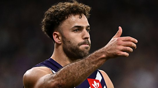 Griffin Logue gets a kick away for Fremantle during the finals.