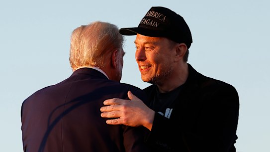 Elon Musk embraces Donald Trump during a campaign rally in October.