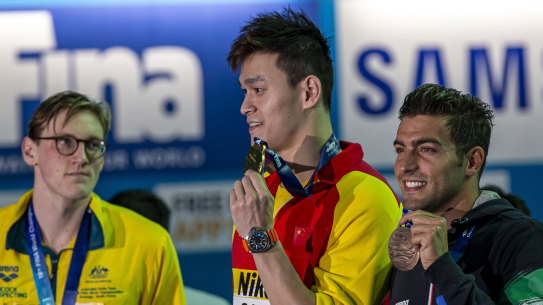 Mack Horton (left) made his point against Sun Yang (centre).