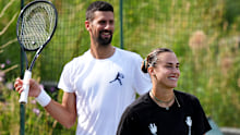 Novak Djokovic and Aryna Sabalenka together at Wimbledon in 2025. 