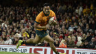 Len Ikitau scores during the big victory over Wales.