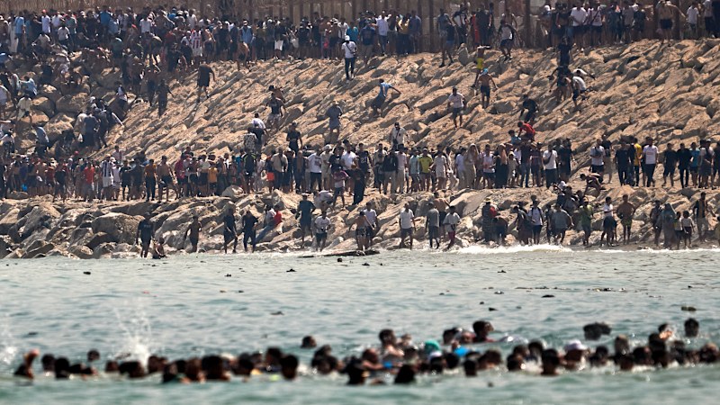 ‘Absolute chaos': Thousands swim to Spanish enclave in migration crisis