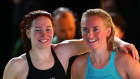 Mollie O’Callaghan and Ariarne Titmus after their epic 200m freestyle final.