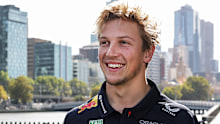 Max Verstappen of the Netherlands and Oracle Red Bull Racing and Liam Lawson of New Zealand and Oracle Red Bull Racing talk at an Oracle Red Bull Racing event during previews ahead of the F1 Grand Prix of Australia at Albert Park Grand Prix Circuit