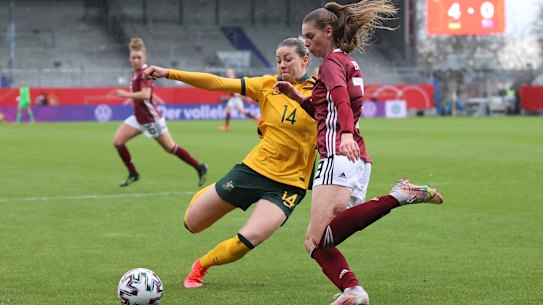 WIESBADEN, GERMANY - APRIL 10: Alanna Kennedy of Australia and Jule Brand of Germany battle for the ball during the Women’s International Friendly match between Germany and Australia at BRITA-Arena on April 10, 2021 in Wiesbaden, Germany. Sporting stadiums around Germany remain under strict restrictions due to the Coronavirus Pandemic as Government social distancing laws prohibit fans inside venues resulting in games being played behind closed doors.  (Photo by Joosep Martinson/Getty Images)