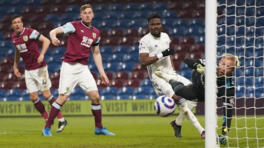 Leicester keeper Kasper Schmeichel saves a shot from Burnley’s Chris Wood at Turf Moor.