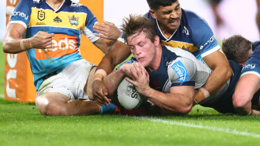 Harry Grant crosses to score despite the attention of three Titans players.