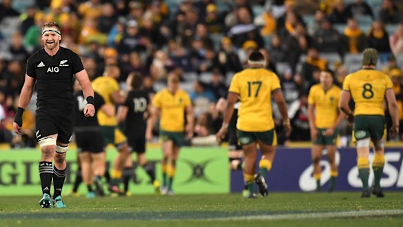 The great divide: Kieran Read reacts after the All Blacks score another try against the Wallabies in Sydney.