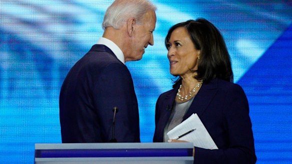 Joe Biden and Kamala Harris shake hands after a Democratic presidential primary debate in September last year.