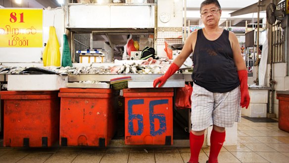 A fish seller in a wet market in Little India, Singapore.